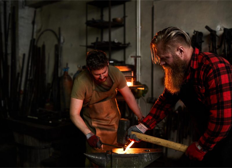 blacksmiths-shaping-metal-together-Z67RLYF.jpg